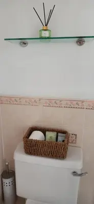 a basket on top of a toilet in a bathroom at The Sandalwood Hotel in Blackpool