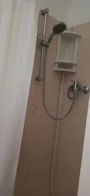 a shower with a shower head in a bathroom at The Sandalwood Hotel in Blackpool