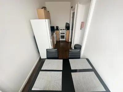a hallway with a black and white floor in a room at The Valley Inn Liverpool in Liverpool