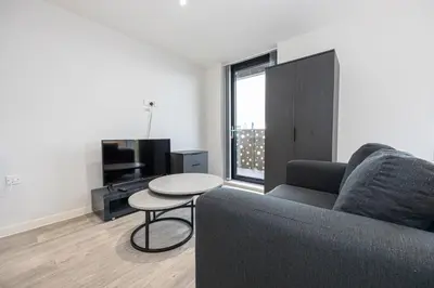 a living room with a couch and a table at GuestReady - Stunning studio in Liverpool in Liverpool