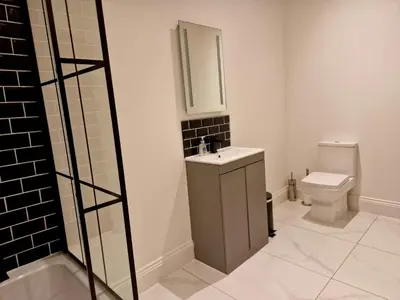 a bathroom with a sink and a toilet at The Hamilton luxury holiday let's- Holly Barn in Scorton