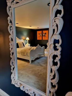 a mirror in a room with a bed in it at Hamilton-The Alexander suite luxury holiday Let's in Scorton