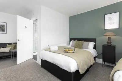 a bedroom with two beds and a couch at Host Liverpool - The Wavertree Rooms in Liverpool