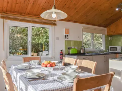 a kitchen with a table with a bowl of fruit on it at Serenity in Millom