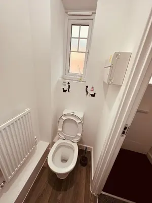 a bathroom with a toilet and a window at Newhaven House in Liverpool