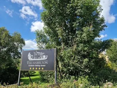 a sign in front of a tree at Lord William in Preston