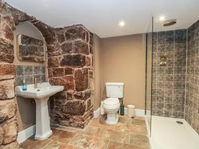 a bathroom with a toilet and a sink and a shower at Lord William in Preston