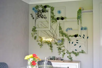 a wall with a sign that says happy on it at Huntsfield House- Stunning Modern 4 Bedroom House Suitable for Work and Leisure Stays in Bamber Bridge