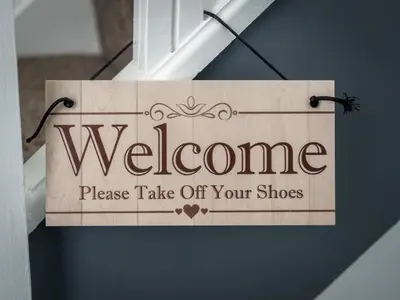 a sign for a door with a welcome sign on it at Preston Serviced Apartment - Estatevision in Preston