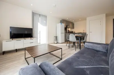 a living room with a couch and a table at GuestReady - Elegant Tranquility in Vauxhall in Liverpool