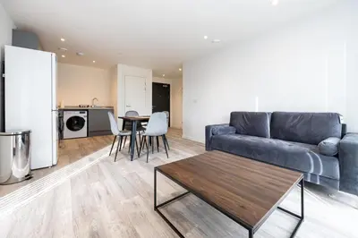 a living room with a couch and a table at GuestReady - Elegant Tranquility in Vauxhall in Liverpool