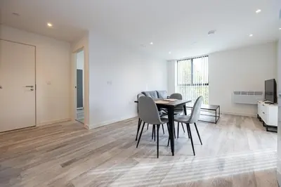 a dining room with a table and chairs at GuestReady - Elegant Tranquility in Vauxhall in Liverpool