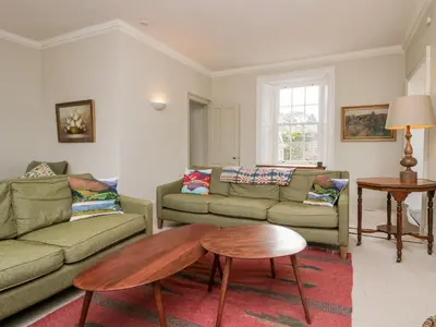 a living room with two couches and a coffee table at Penny Bridge House in Ulverston