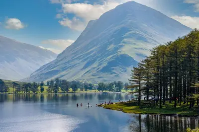 a mountain with a lake in front of a mountain at Lonsdale House Boutique Apartments in Ulverston