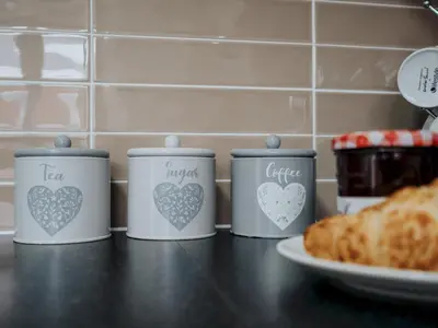 four cans with hearts on them sitting on a counter at Modern and Cozy Kirkby Retreat Parking Sleeps 5 - Pass the Keys in Knowsley