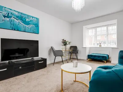 a living room with a couch and a table at Modern and Cozy Kirkby Retreat Parking Sleeps 5 - Pass the Keys in Knowsley