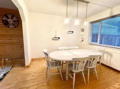 a dining room with a white table and chairs at Entire house - Peaceful 3 bedroom home in Rishton