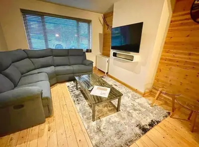 a living room with a couch and a coffee table at Entire house - Peaceful 3 bedroom home in Rishton