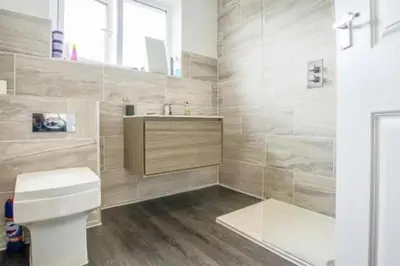 a bathroom with a toilet and a sink at Entire house - Peaceful 3 bedroom home in Rishton