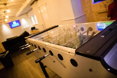 a table with a video game in a room at Cliffs Hotel in Blackpool