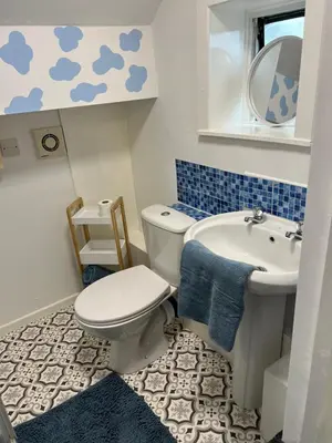 a small bathroom with a toilet and a sink at Quirky Attic Blackpool in Blackpool