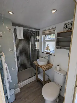 a bathroom with a toilet and a sink at La Cachette in Blackpool