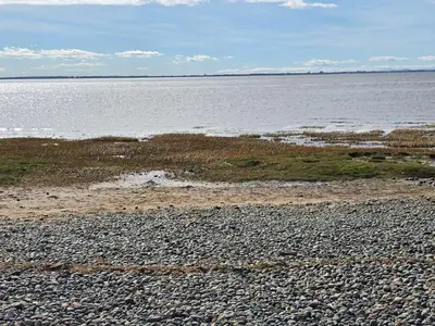 a rocky beach with a large body of water at Windmill House LYTHAM in Lytham St Annes
