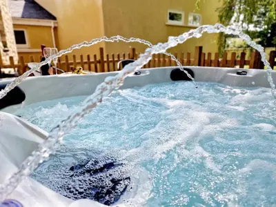 a bath tub filled with water with a hose at The Hamilton Luxury Let-The Duke in Scorton