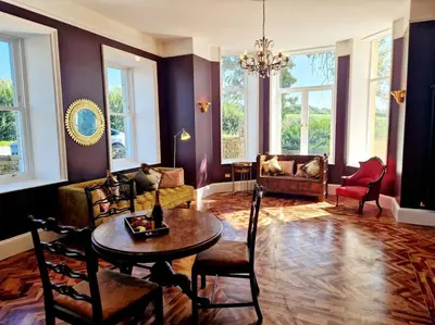 a living room with a couch and a table and chairs at The Hamilton Luxury Let-The Duke in Scorton