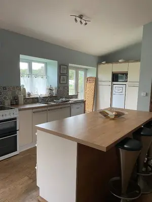 a kitchen with a wooden counter top in a room at Strawberry Fields in Liverpool