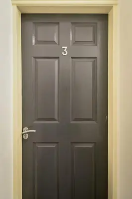 a gray door with the number thirtyfive on it at Suite in the heart of Great Harwood in Great Harwood
