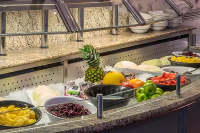 a bunch of fruits and vegetables on a shelf at Imperial Hotel Blackpool in Blackpool