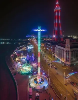a city lit up at night with a tower at The Bailey Hotel Blackpool in Blackpool