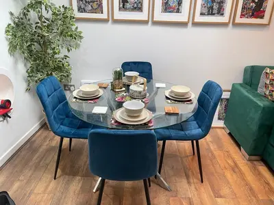 a dining room table with blue chairs and a tableasteryasteryasteryasteryasteryastery at Fantastic Liverpool City Centre Apartments, Fenwick Street in Liverpool