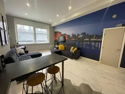a living room with a couch and a table at Fantastic Liverpool City Centre Apartments, Fenwick Street in Liverpool