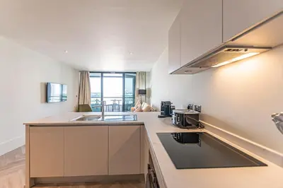 a kitchen with a sink and a counter top at 1BR Apt - Balcony - River View in Liverpool