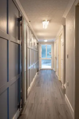 an empty hallway with a door and a window at Lakeland Lodge 9B Arnside , Carnforth ,Lancaster , LA61BH in Carnforth