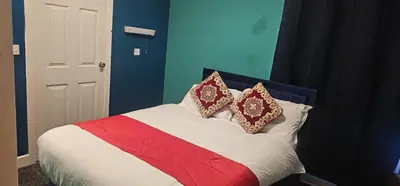 a bed with two pillows on top of it at North Ocean Hotel in Blackpool