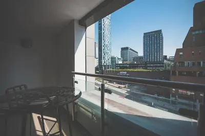 a balcony with a table and a view of a city at 1 Bed Apt - Balcony - City View - Great Location in Liverpool