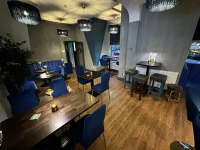 an overhead view of a restaurant with tables and chairs at Hotel Neon in Blackpool