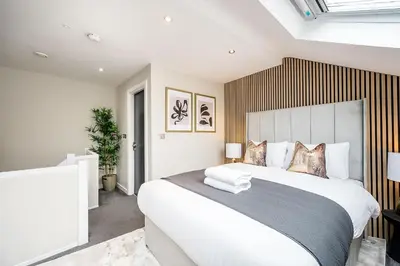 a bedroom with a large white bed in a room at Host & Stay - Halifax House Living in Liverpool