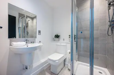 a bathroom with a toilet and a sink and a shower at Host & Stay - Halifax House Living in Liverpool