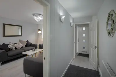 a living room with a couch and a table at Lovely Home in Blackpool For You in Blackpool