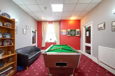 a room with a pool table in a room at The Wilton International in Blackpool