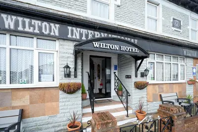 a building with the entrance to a wharton hotel at The Wilton International in Blackpool