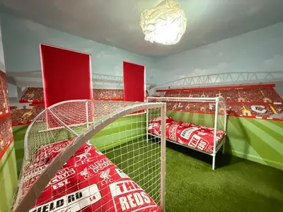 a dressing room with a football stadium with a soccer field at Anfield Abode - ENTIRE LFC THEMED HOUSE - Sleeps 6 in Liverpool