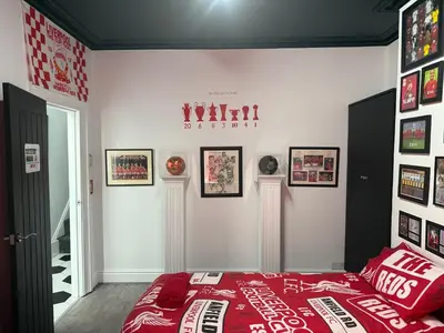 a bedroom with a coca cola bed and pictures on the wall at Anfield Abode - ENTIRE LFC THEMED HOUSE - Sleeps 6 in Liverpool