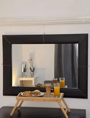a mirror reflecting a table with a plate of food at Cheerful Home near Preston train station & Uclan in Preston