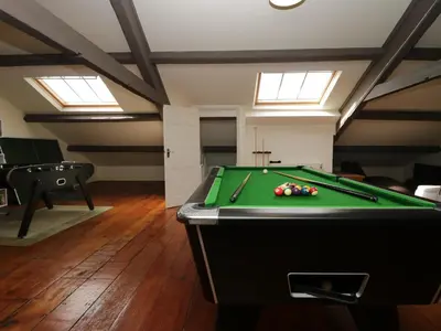 a pool table in a room with skylights at Holmere Bank in Carnforth