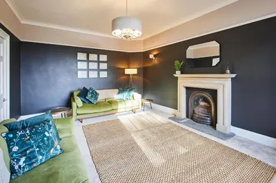 a living room with a couch and a fireplace at Host & Stay - South View in High Newton